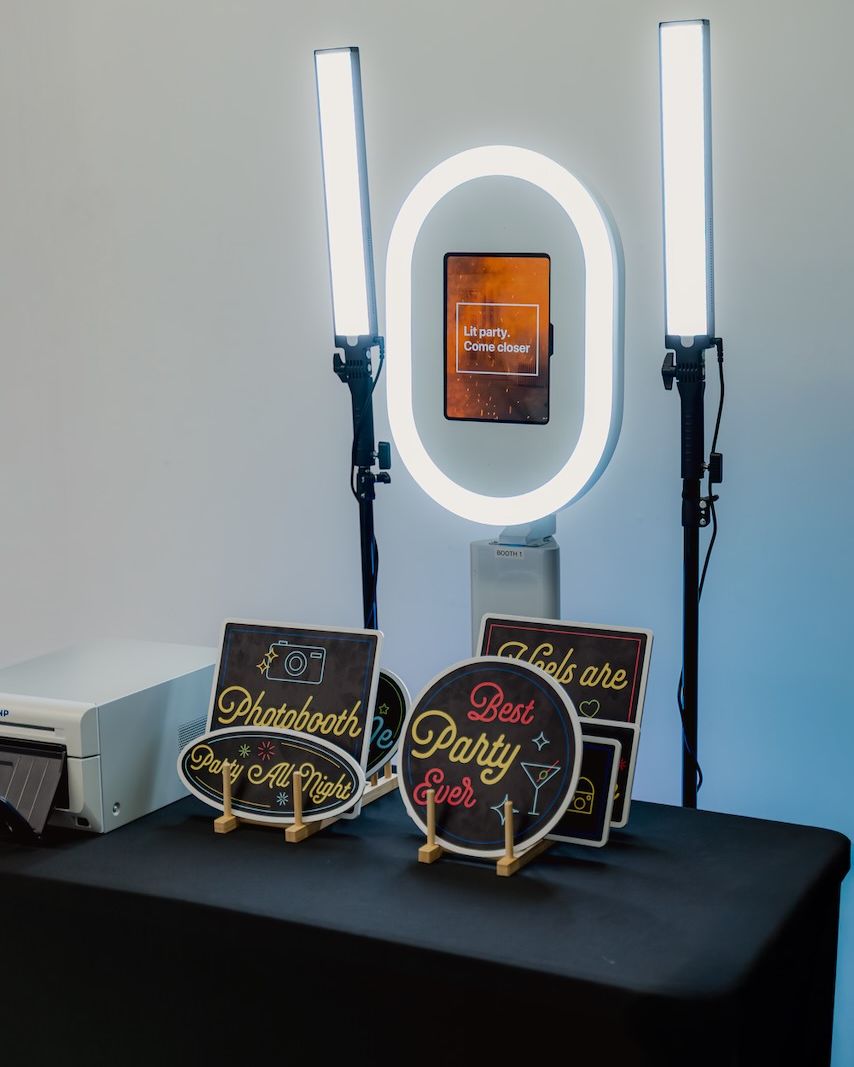 Encore booth with studio lighting and printer